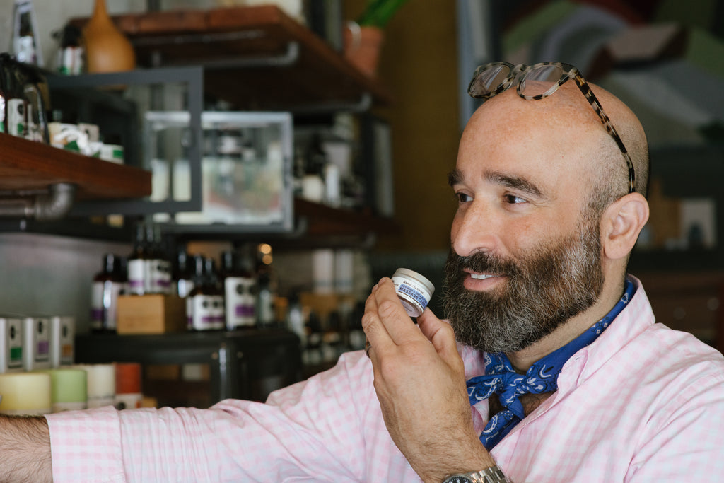 JP smelling a soy massage candle